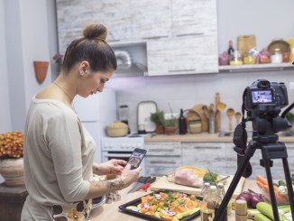 Woman enjoying cooking and vlogging