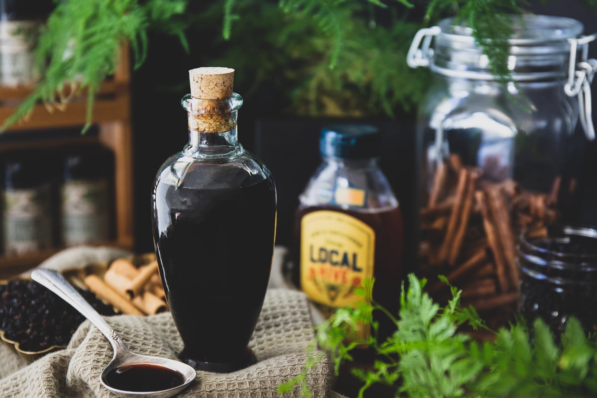 Simmering Organic Elderberries in Traditional Pot